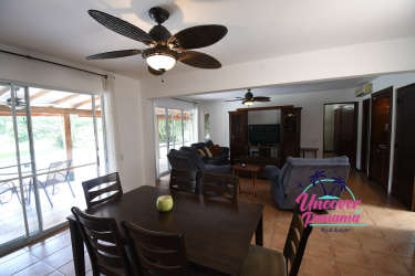 Open concept living and dining room with large windows in luxury townhouse Costa Blanca Golf Villas Panama
