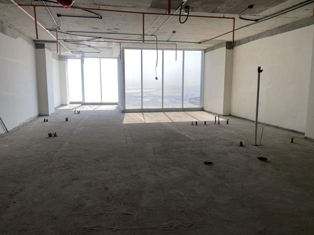 Unfinished commercial shell space featuring floor-to-ceiling windows with Panama Bay views in PH BICSA Tower