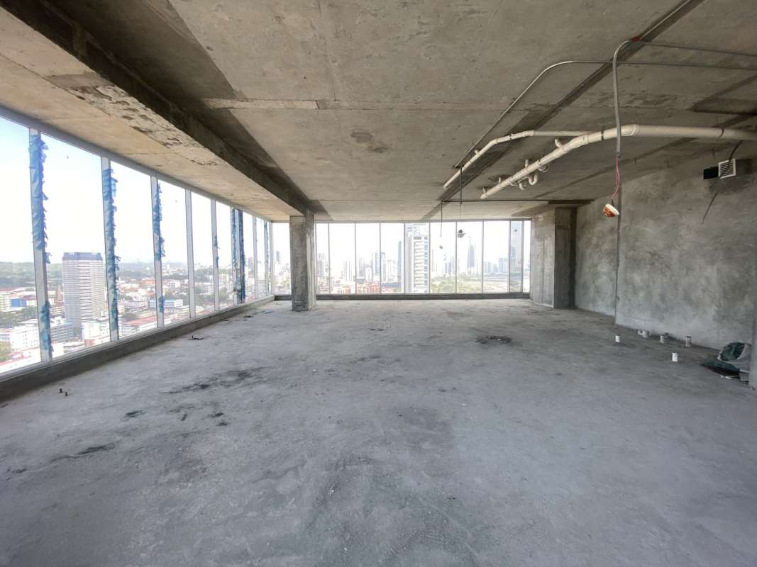 Shell condition commercial unit with concrete floor and large panoramic windows inside PH BICSA Tower Panama City