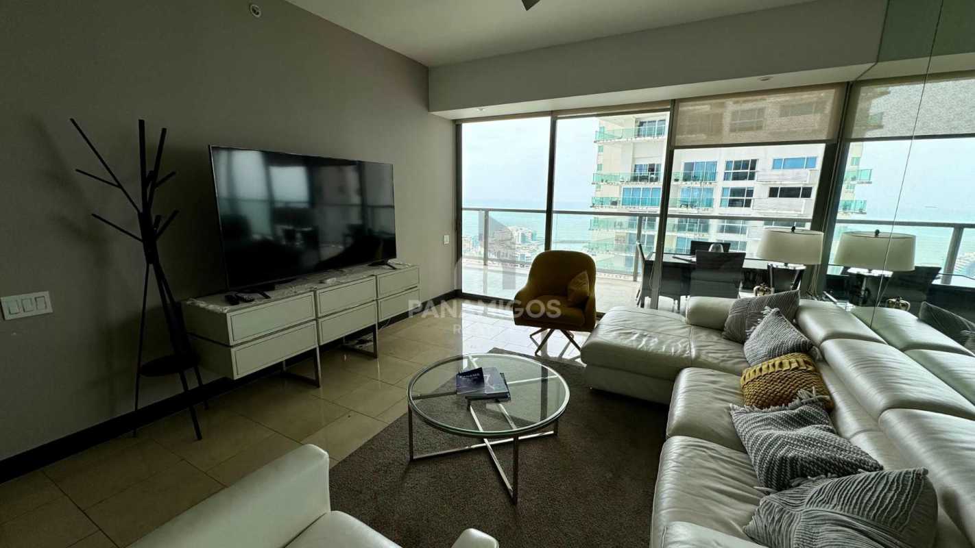 Dining area with stunning ocean bay view through large windows at The Ocean Club Panama