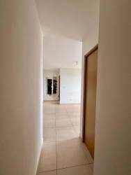 Compact kitchen with electric stove, modern cabinets in PH Parterre Panama Pacifico