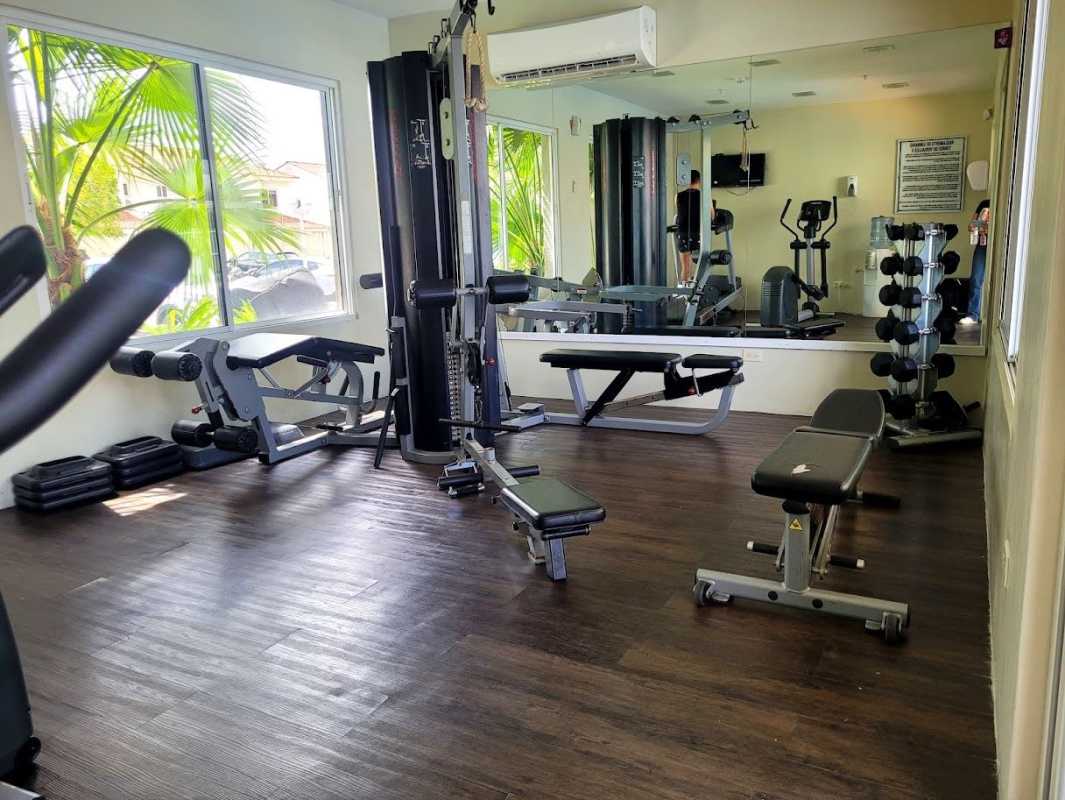 Swimming pool with lounge area at PH Torres de Versailles Costa Sur Panama City