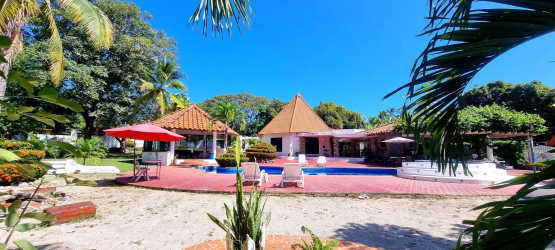 Outdoor swimming pool jacuzzi red tile deck lush tropical gardens Playa Malibu Gorgona