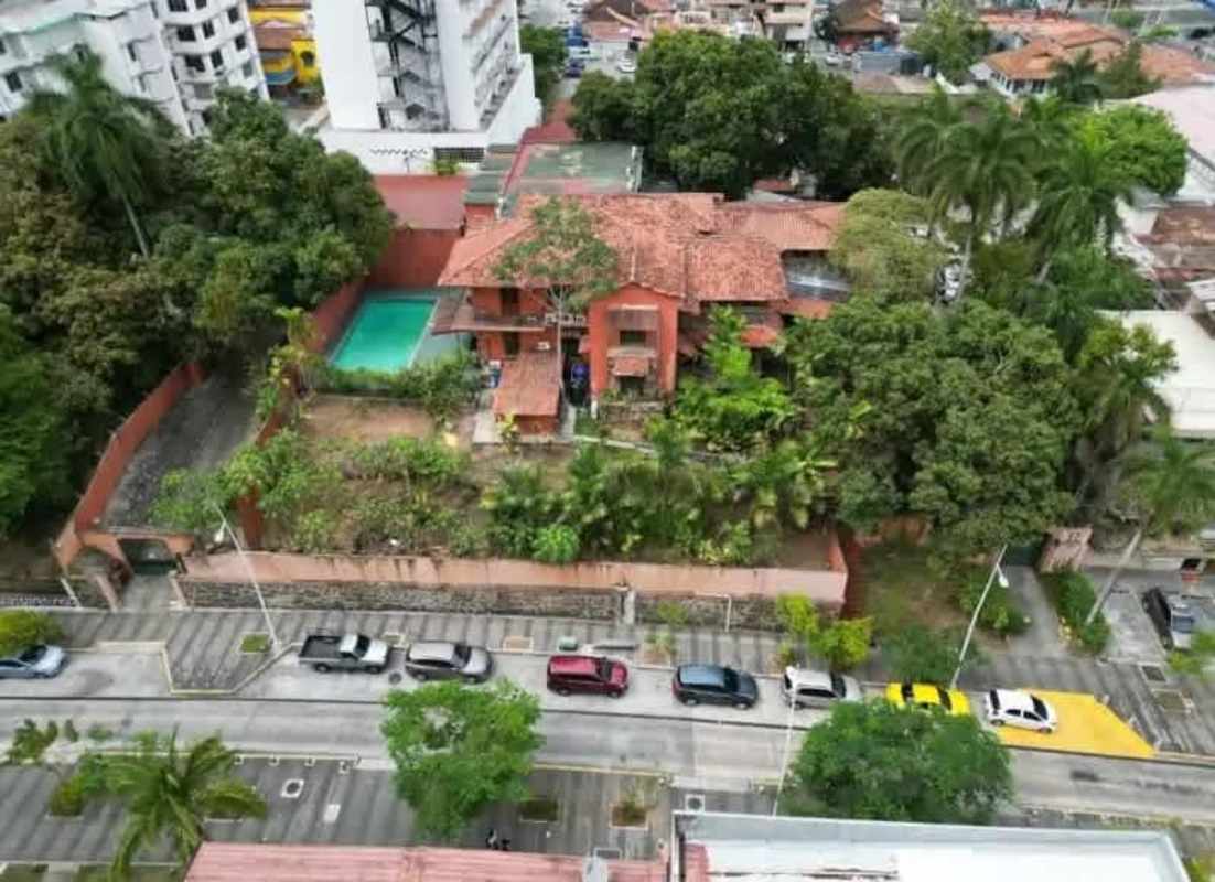Rustic Mediterranean style entrance with gardens and brick arch Bella Vista mansion Panama
