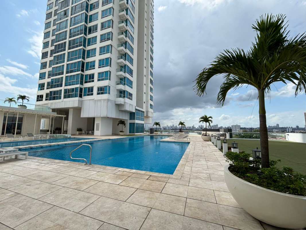 Open-plan living and dining area with floor-to-ceiling windows city skyline view at Top Towers Costa del Este Panama