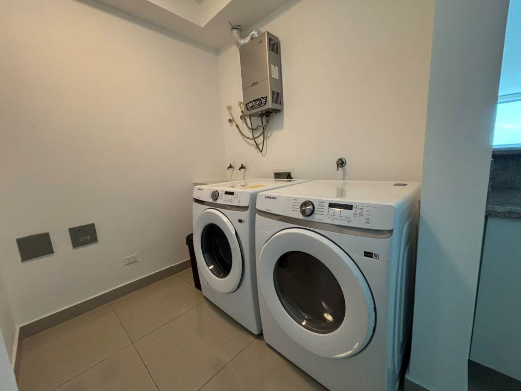 Luxury bathroom with glass shower, modern vanity at Top Towers Costa del Este Panama