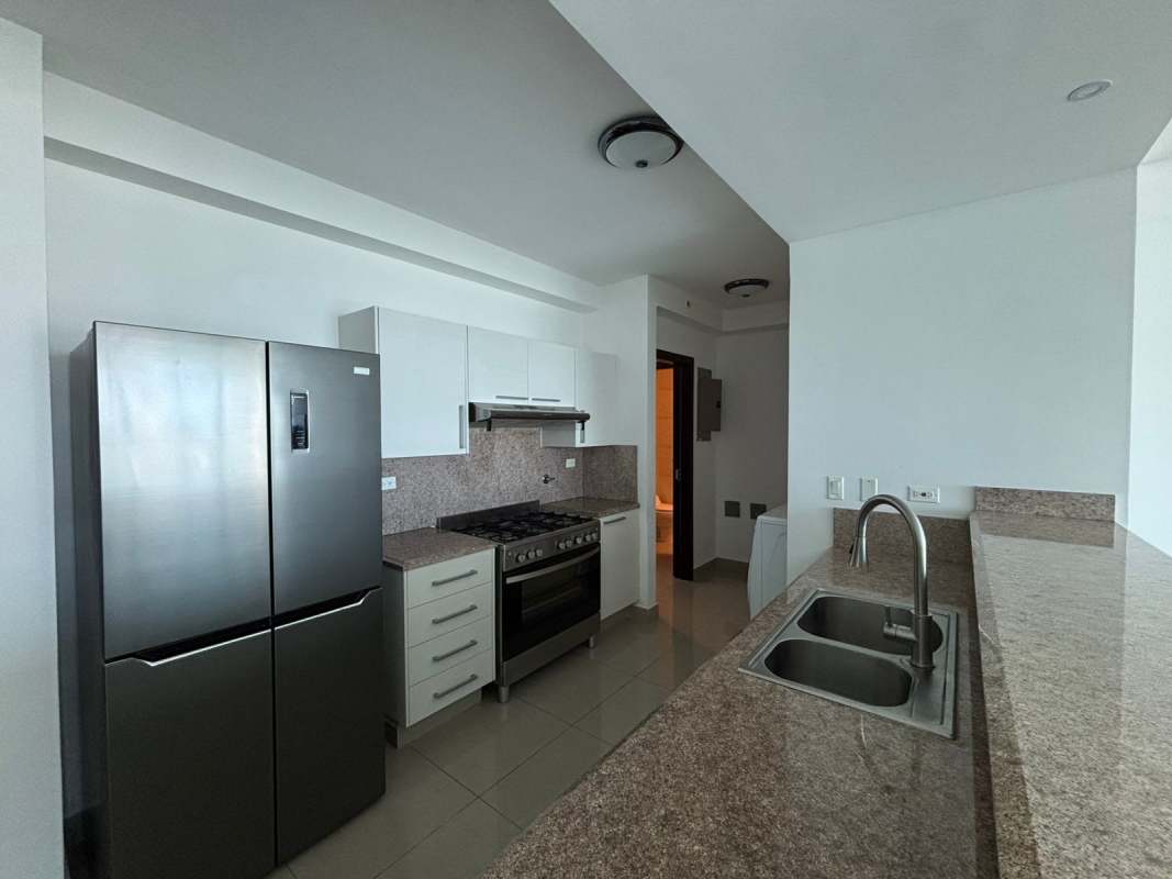 Spacious bedroom with large windows and city skyline view at Top Towers Costa del Este Panama