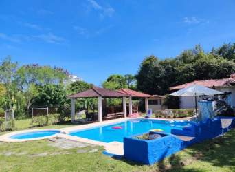 Outdoor tropical swimming pool with gazebo and gardens Coronado Panama vacation rental