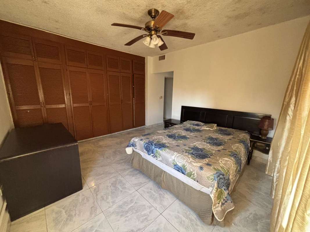 Kitchen with tile finishes and city view window PH Villa Cangrejo Panama