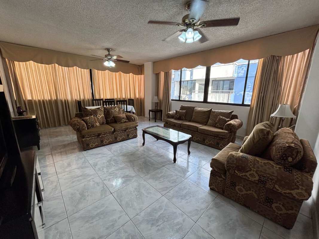 Bright living dining area tiled floors ceiling fans Panama City rental
