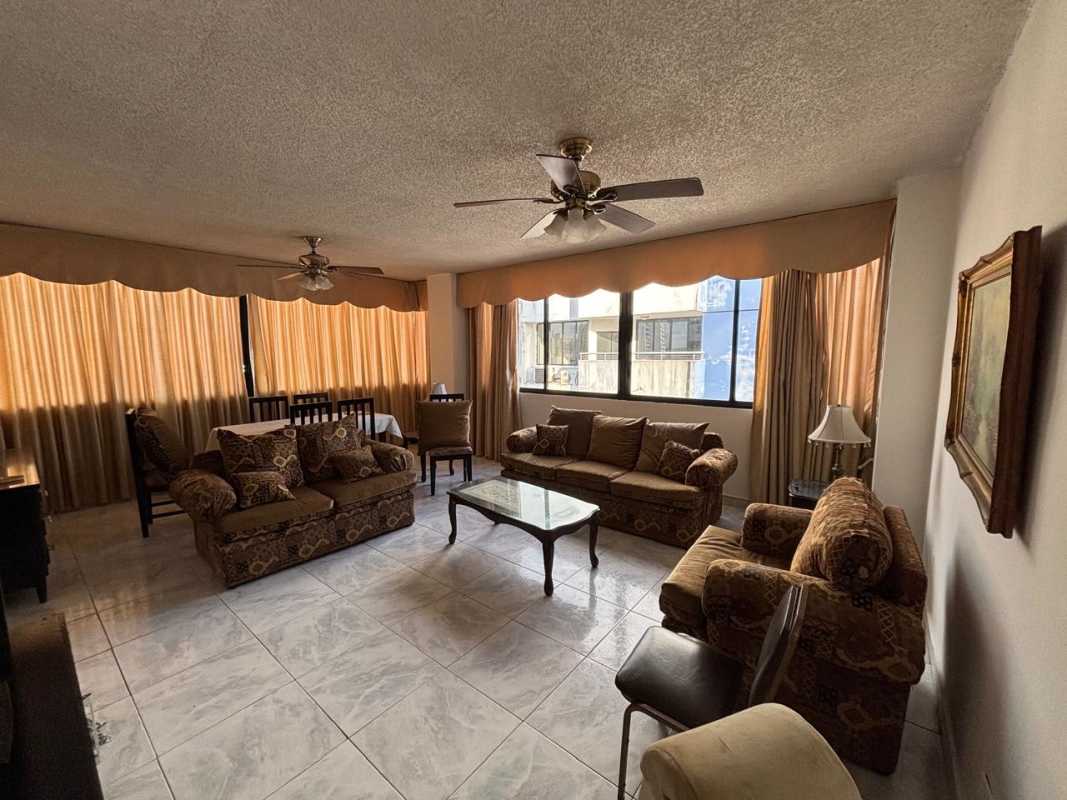 Large furnished living room with balcony, natural light, classic decor PH Coral Plaza El Cangrejo Panama