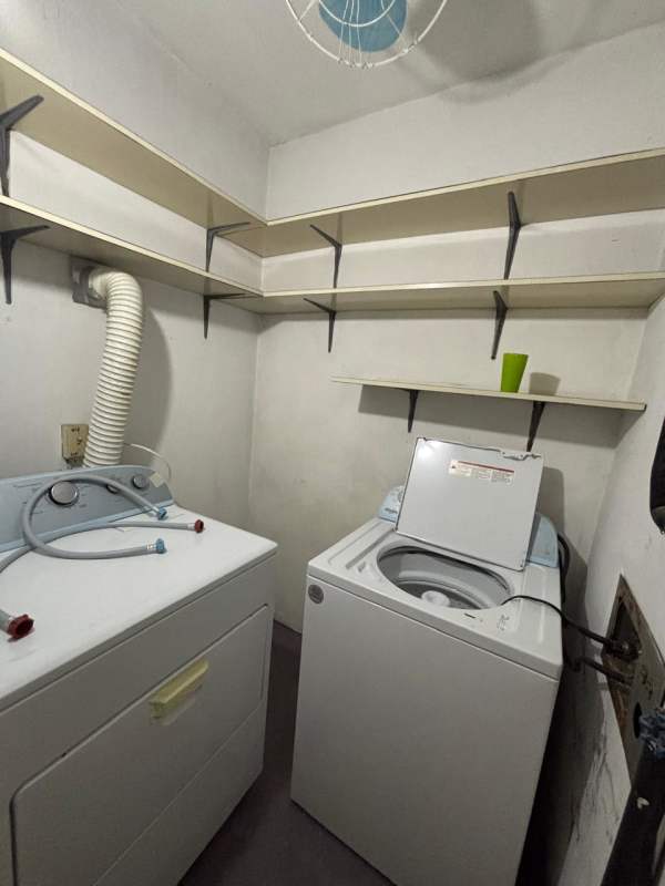 Combined living dining room with tile floors, curtains, fans in PH Coral Plaza El Cangrejo Panama City