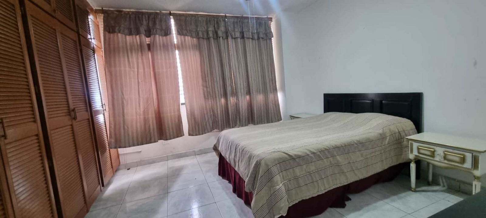 Bathroom with frosted shower door, blue tiles, vanity PH Coral Plaza El Cangrejo Panama rental