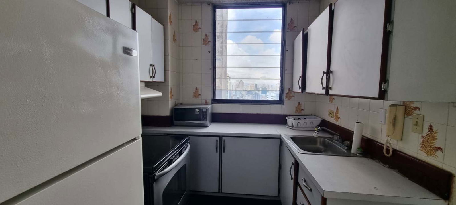 Compact kitchen with window, appliances and view PH Coral Plaza Panama rental