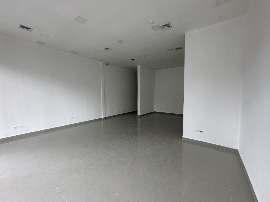 Open layout commercial space with high ceilings grey tiled floor Via Brasil Panama