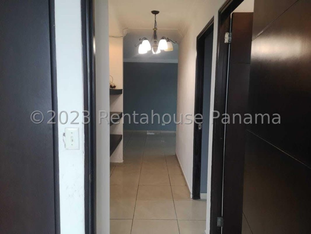 Hallway with tile floor lighting connecting rooms in PH Villa de Las Fuentes Panama