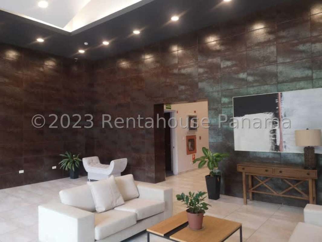 Modern lobby with seating and art at PH Villa de Las Fuentes Tumba Muerto Panama City