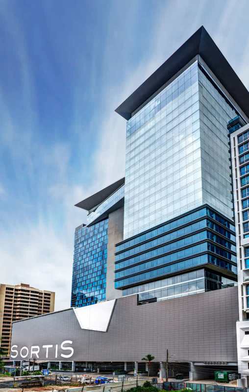 Modern glass skyscraper facade of Sortis Business Tower in Obarrio Panama City