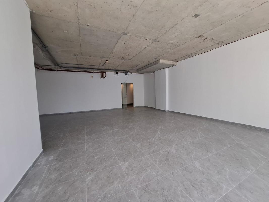 Unfinished open plan office with concrete ceiling and tiled floor in Sortis Business Tower Obarrio Panama