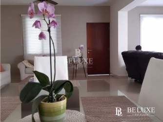 L-shaped modern kitchen with granite countertops, large window, stainless appliances in PH River Valley Panama Pacifico