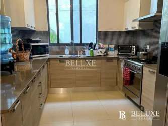 Modern kitchen with large window and appliances in PH River Valley Panama Pacifico