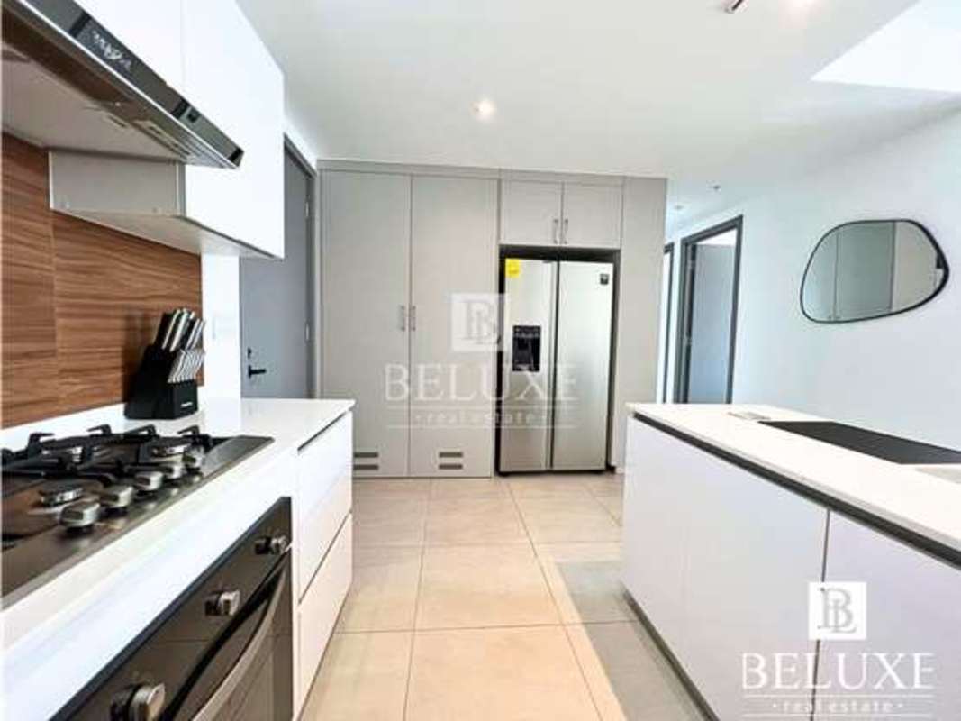 Bright bedroom with panoramic window and city views in PH Van Gogh El Cangrejo Panama