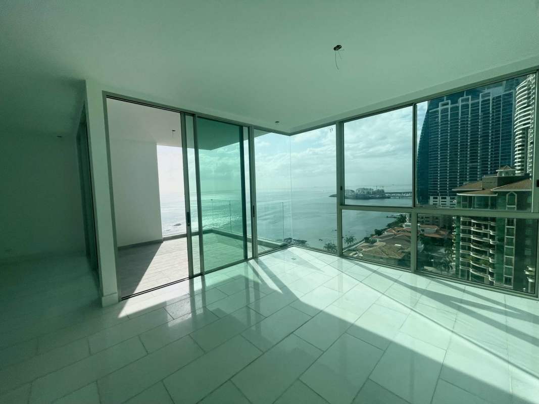 Spacious minimalist living dining area with tile floors Pacific Point Punta Pacifica