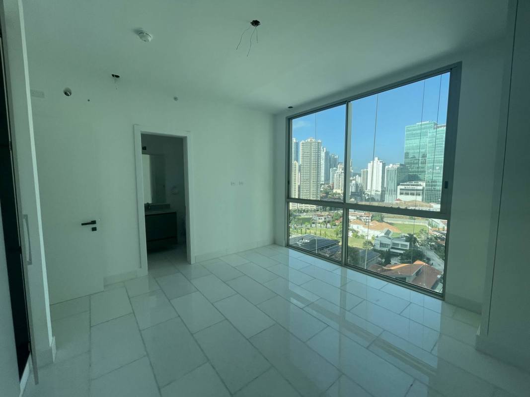 Master bedroom panoramic windows ocean view luxury apartment Punta Pacifica Panama