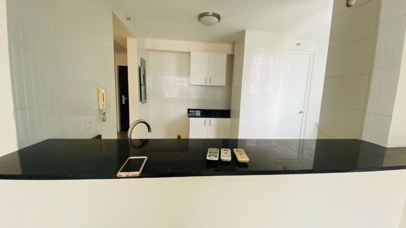 Bedroom with city skyline views and ample light Bella Vista apartment Panama City