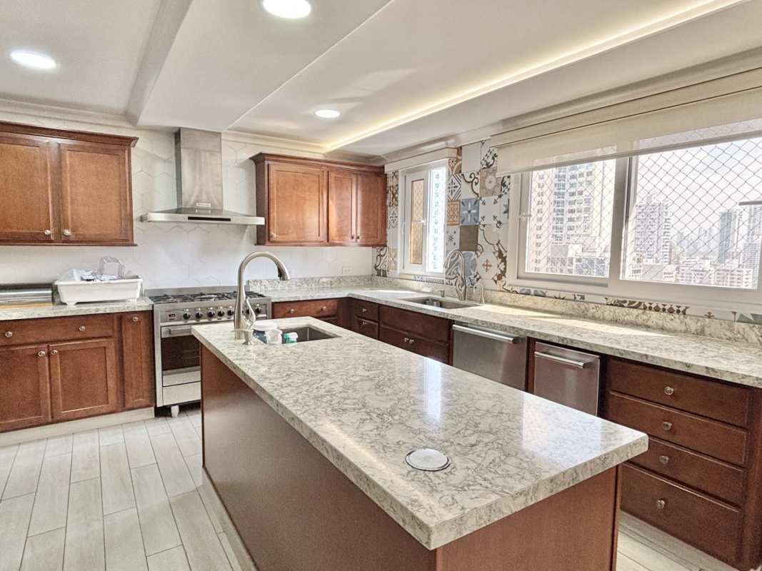 Remodeled kitchen with eclectic tile backsplash island and granite tops PH Country Park Panama