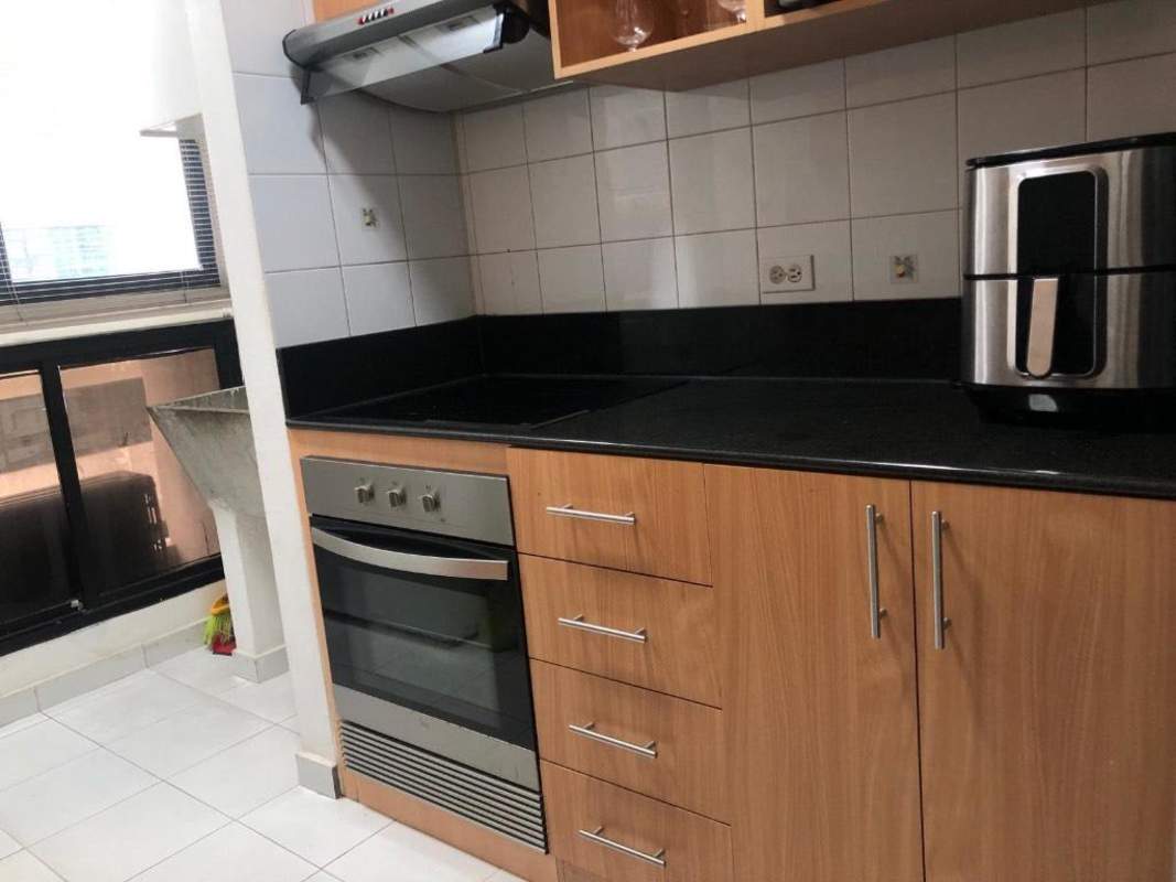 Modern kitchen with granite counter, built-in oven, large window, Marbella City Center Panama