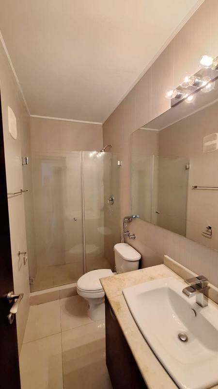 Contemporary granite kitchen with appliances at PH LaCosta Tower Costa del Este Panama apartment for sale