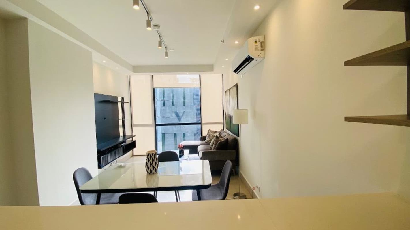 Bright furnished living and dining area with ocean view balcony in Panama City for rent