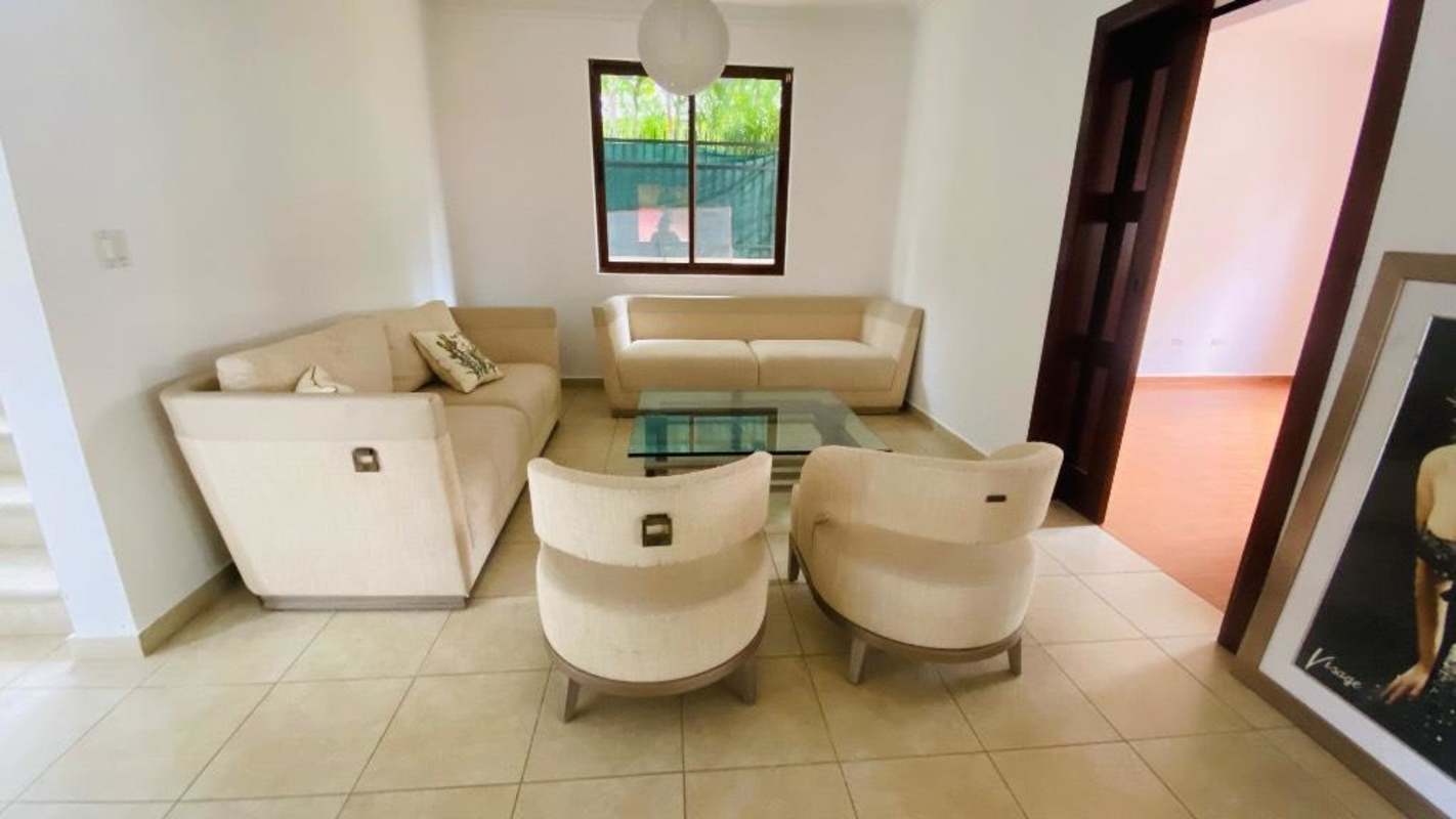 Entrance hall with armchairs, tile floor, staircase, Villa de las Fuentes furnished house El Dorado