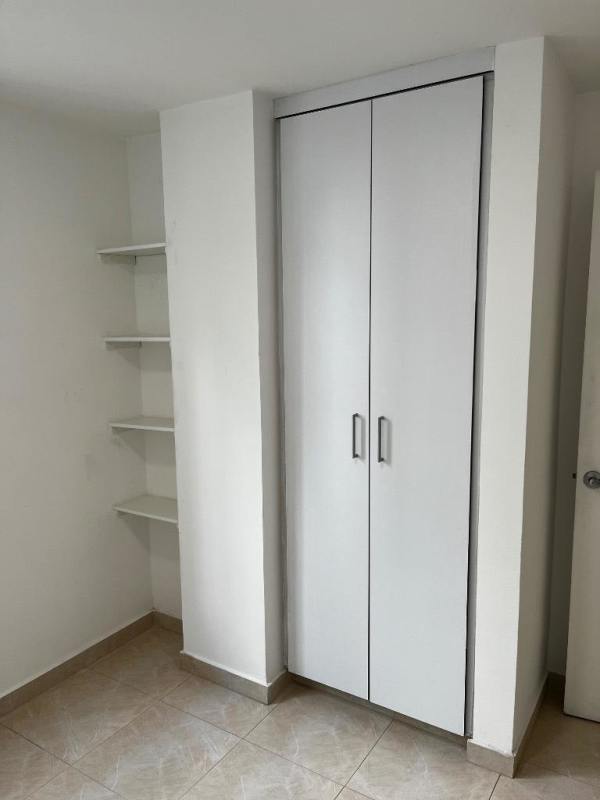 Minimalist bedroom with closet storage in PH Elmare San Miguelito Panama