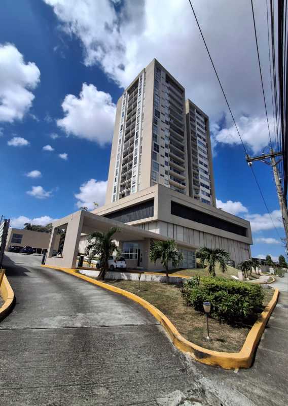 Condominium tower exterior, balconies, lush landscape in Villa Lucre Panama City