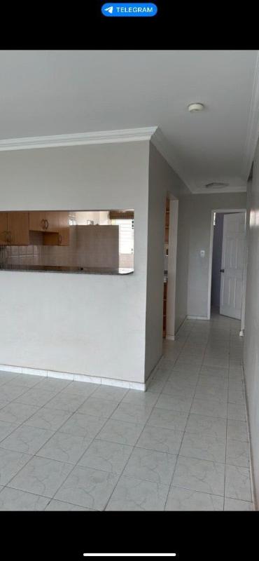Small bathroom with shower, frosted glass panel, tiled walls in Villa de las Fuentes Panama