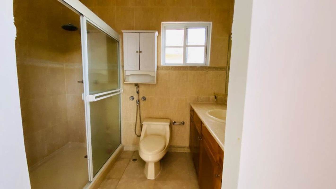 Entrance hall with ornate staircase, chandelier in Costa del Este home