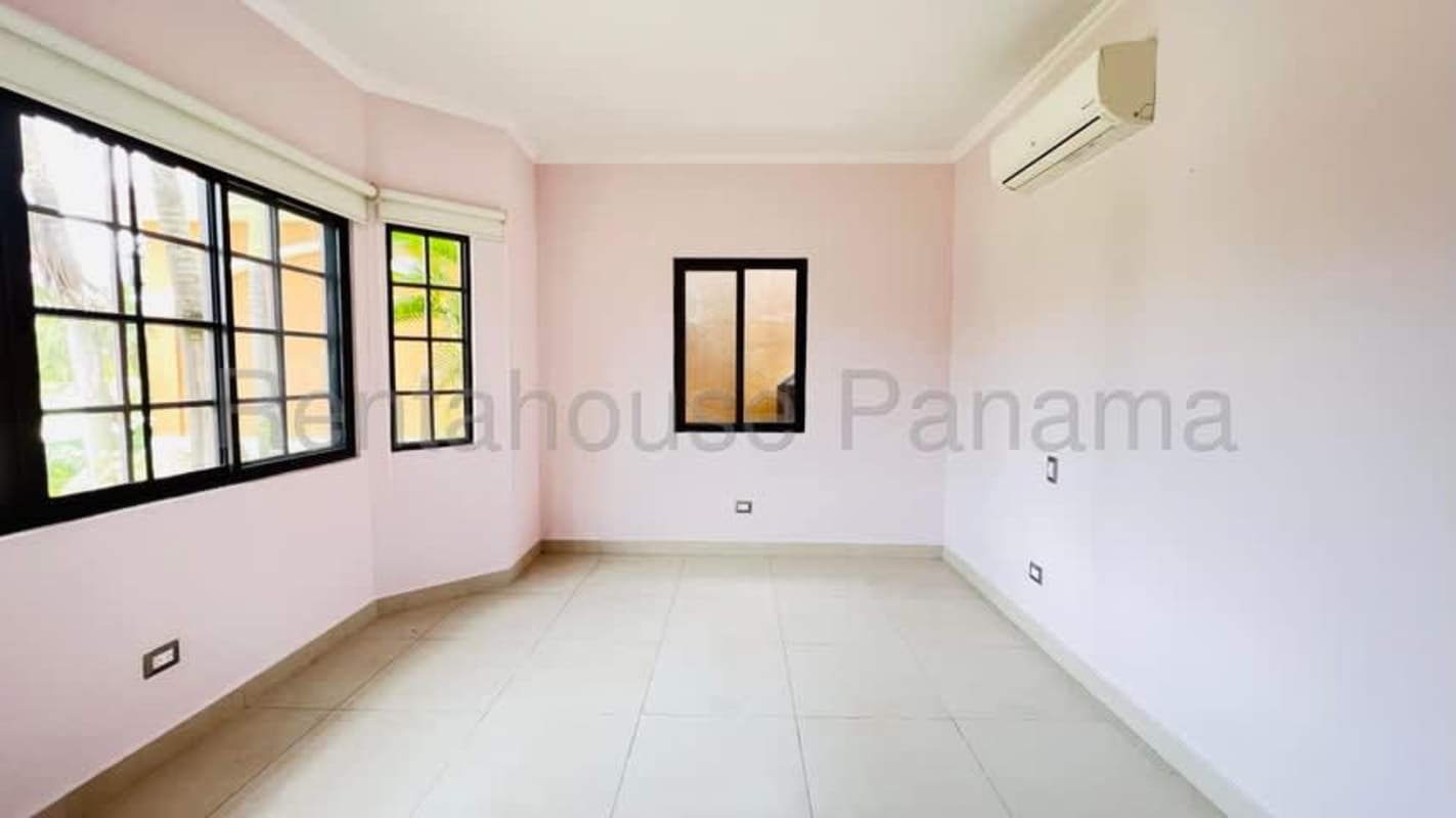 Modern bathroom Costa Sur with walk-in glass shower, granite sink, contemporary fixtures.