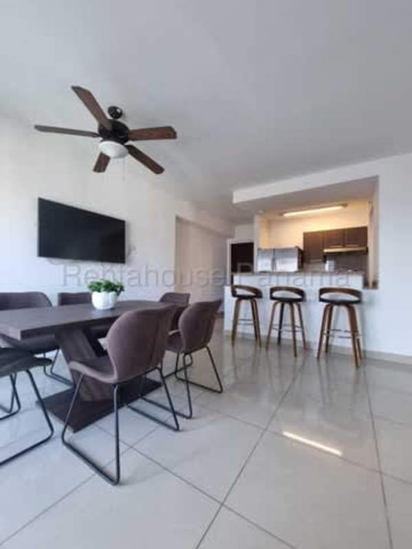 Living room with large glass doors to balcony, skyline views at PH Top Towers Costa del Este