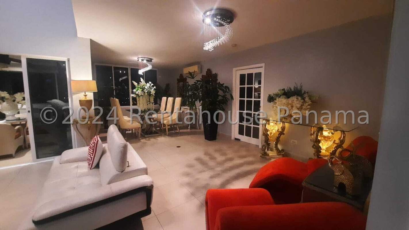 Spacious double-height living room with chandelier and stylish furnishings in Panama City