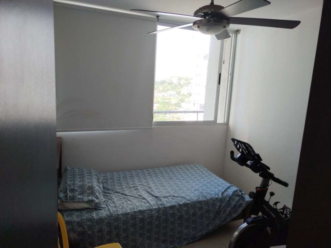 Bedroom featuring window with roller blind, ceiling fan, exercise bike PH Alsacia Tower Panama