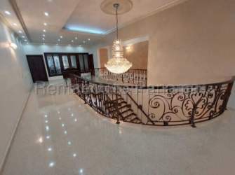 Modern bathroom with marble counters walk-in glass shower in luxury mansion Colon Panama