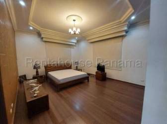 Spacious bedroom with wood floors tray ceiling in exclusive house Margarita Colon Panama