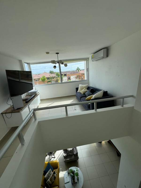 Spacious bedroom with large windows, balcony, and split AC in Costa Sur Village Panama