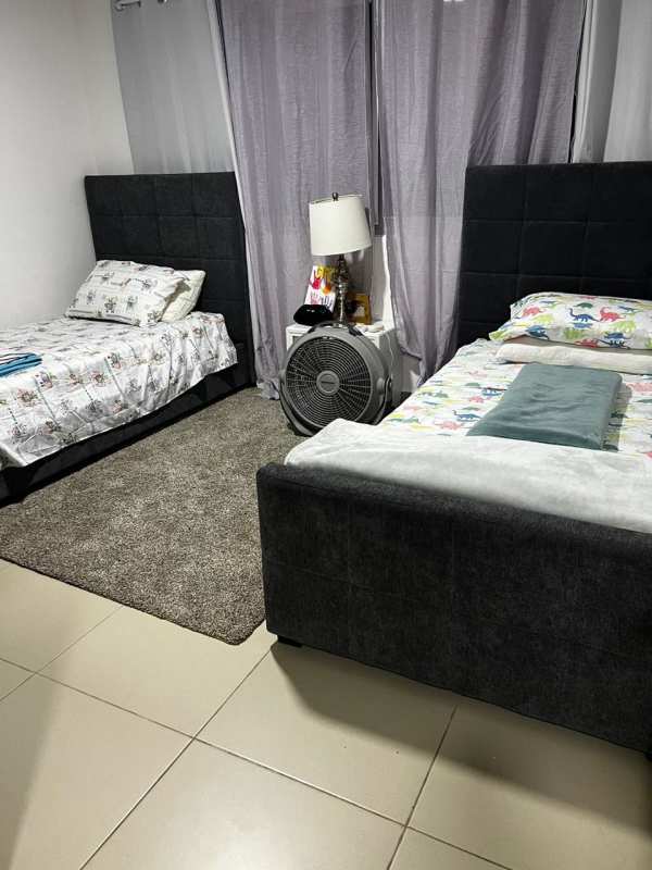 Open kitchen with island, light cabinetry and appliances Costa Sur Village Panama