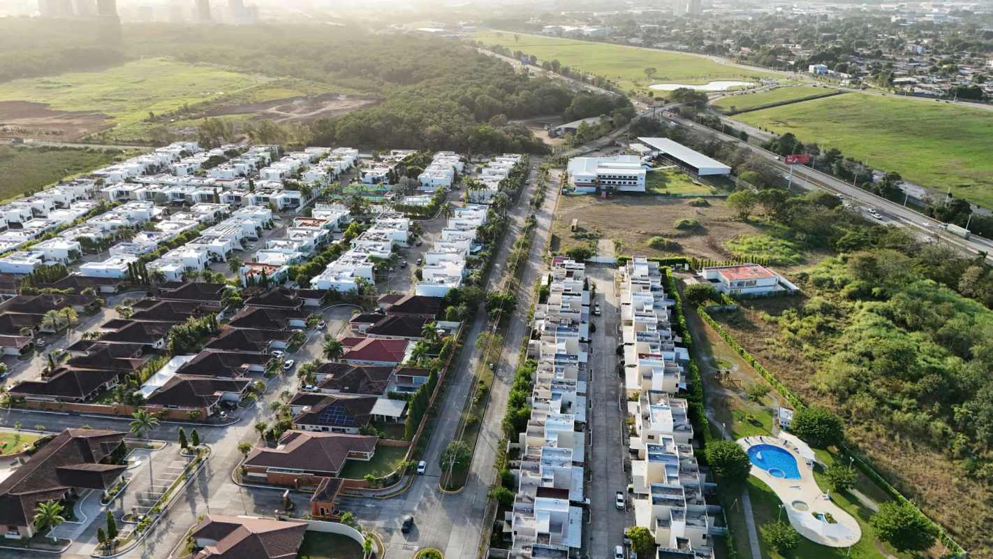 Bright living room with modern decor, sofa and large windows in Costa Sur Village Panama