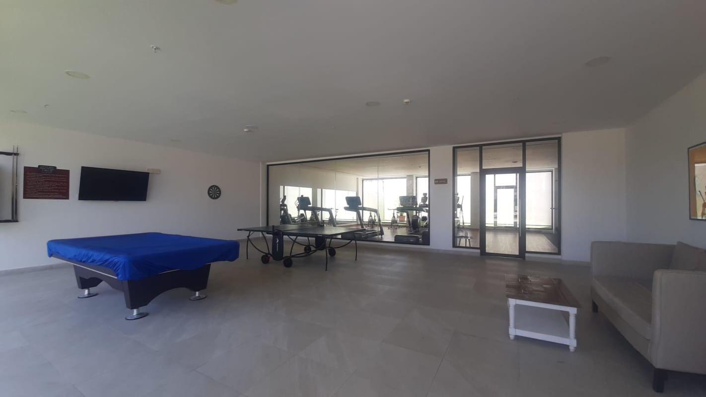 Game room and gym with pool table, ping pong table, cardio zone in PH Condado View Tower 200 Panama City