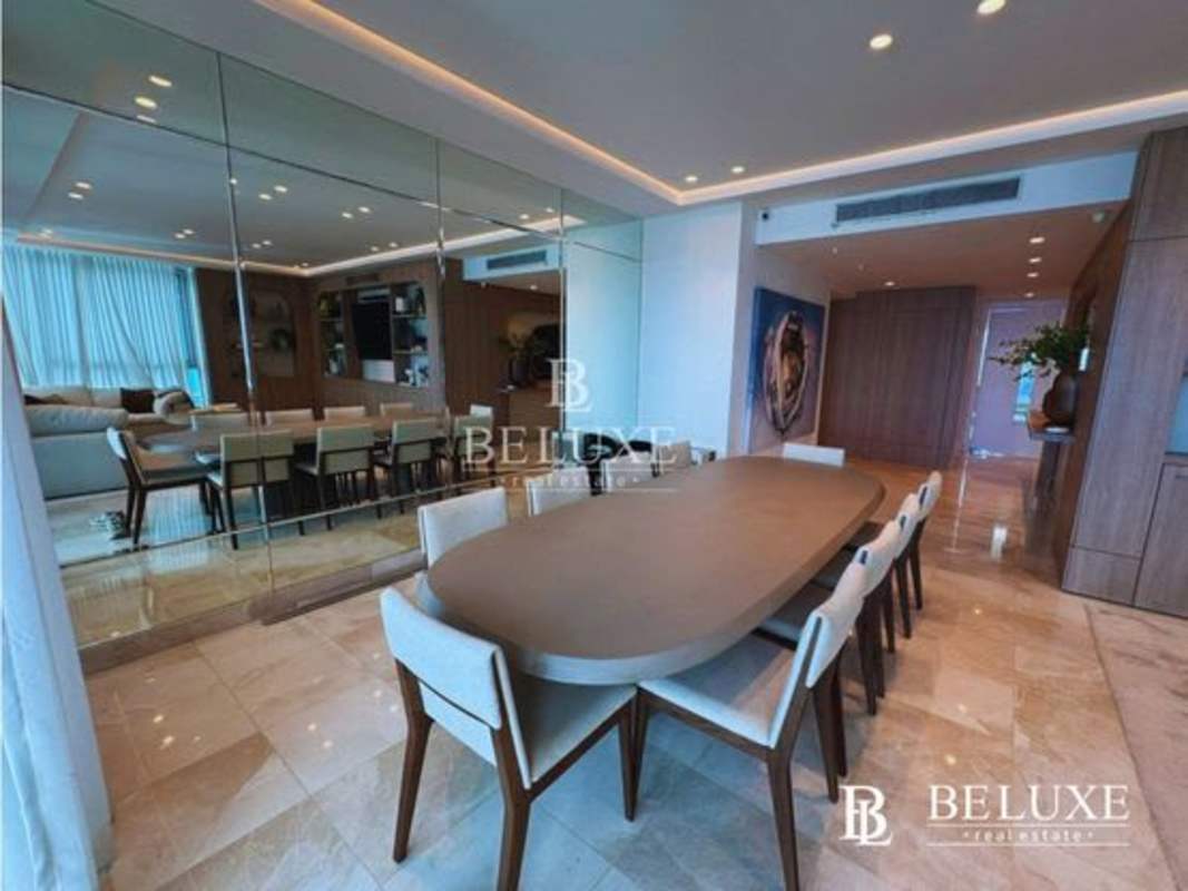 Modern dining area with marble flooring and wall mirrors PH Pacific Village Punta Pacifica Panama