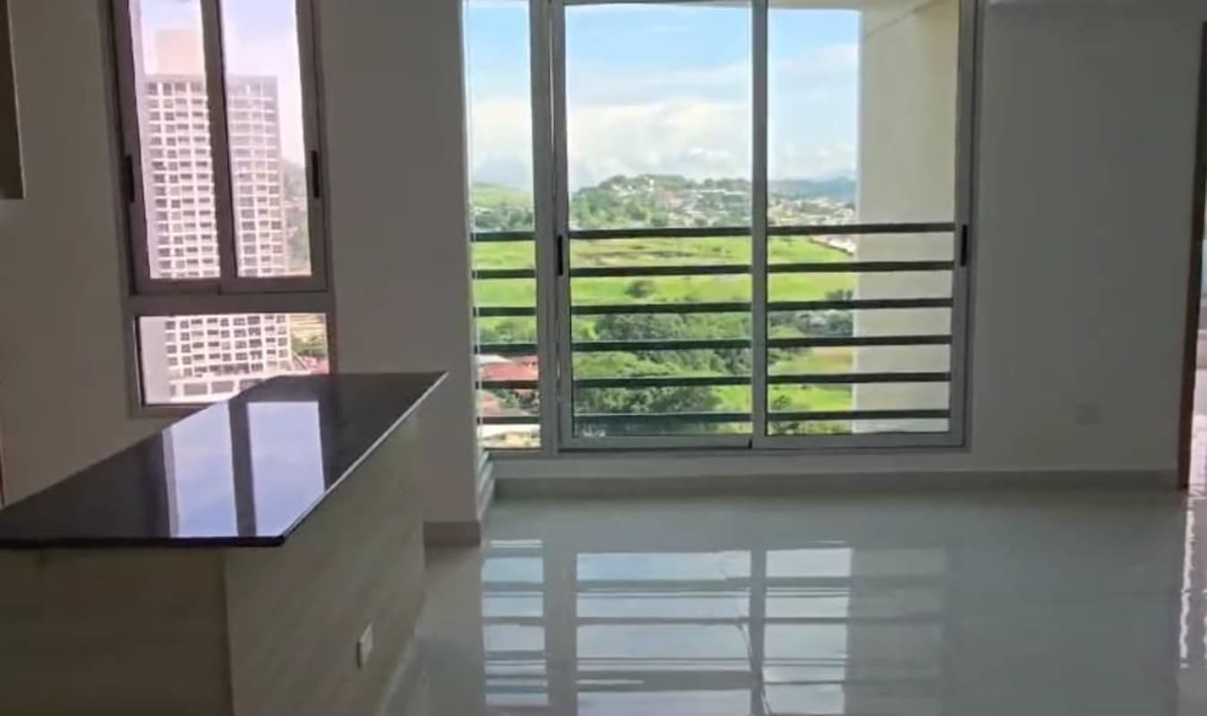 Modern apartment living room with large sliding glass doors and balcony PH City Garden Panama City